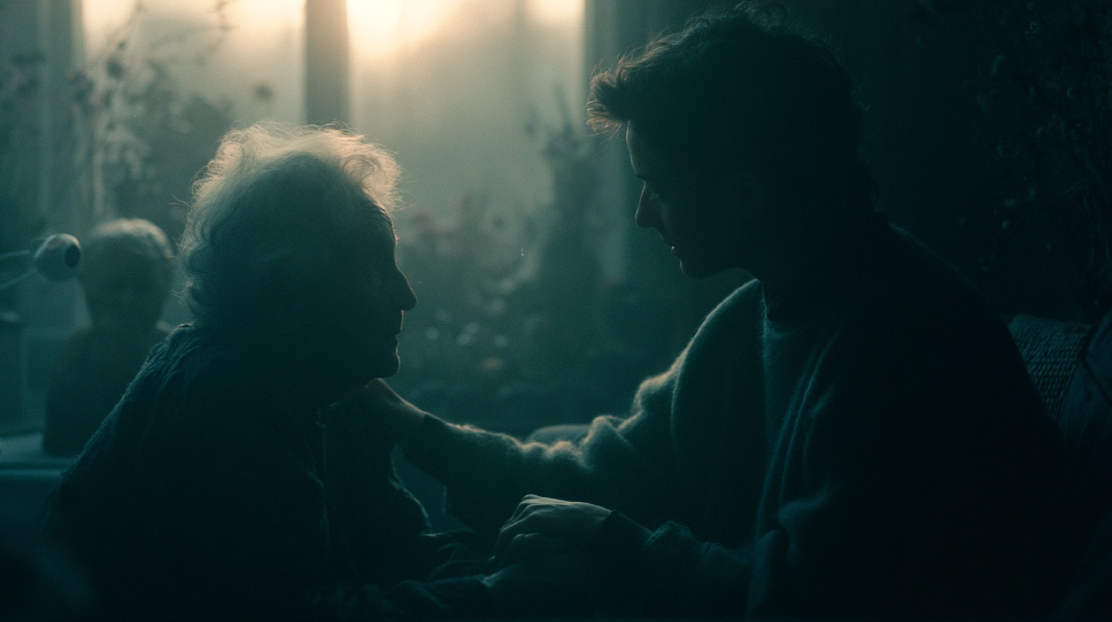A gentle moment — younger hands holding an elder's, in soft dawn light